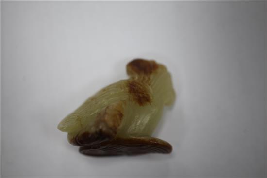 A small Chinese yellow and russet jade figure of a phoenix, 18th century, 4.5cm
